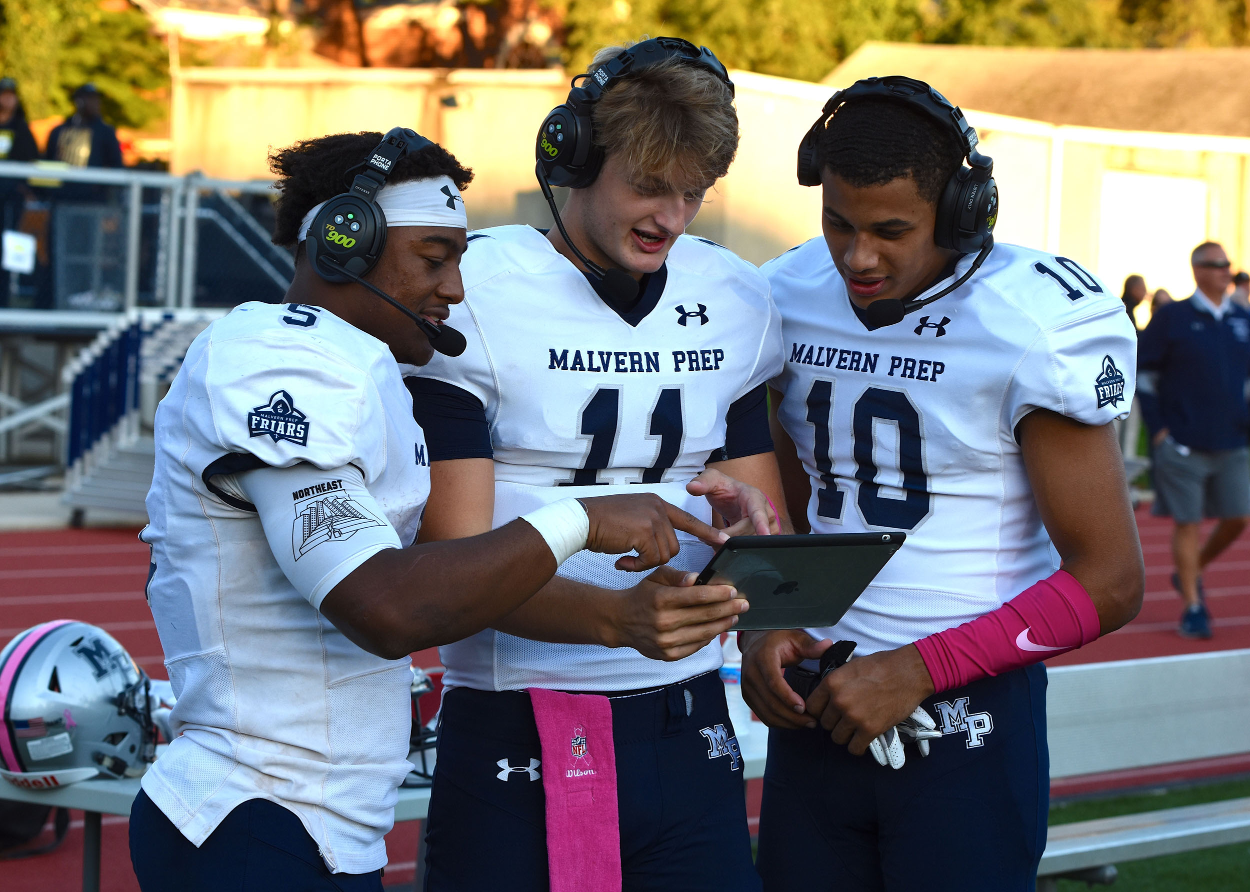 Malvern Prep players looking at video from the game