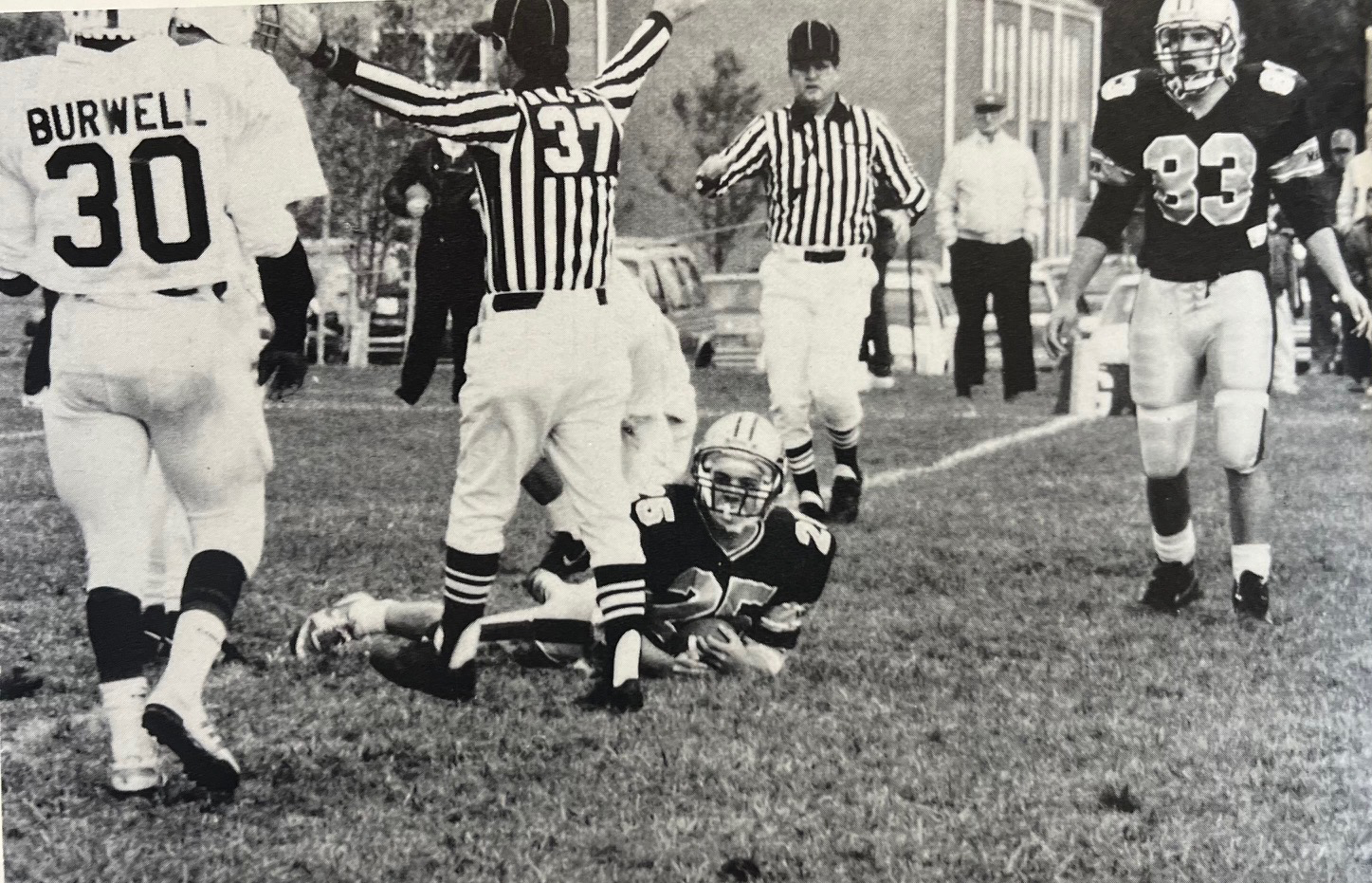 Malvern ball carrier on the ground holding the ball